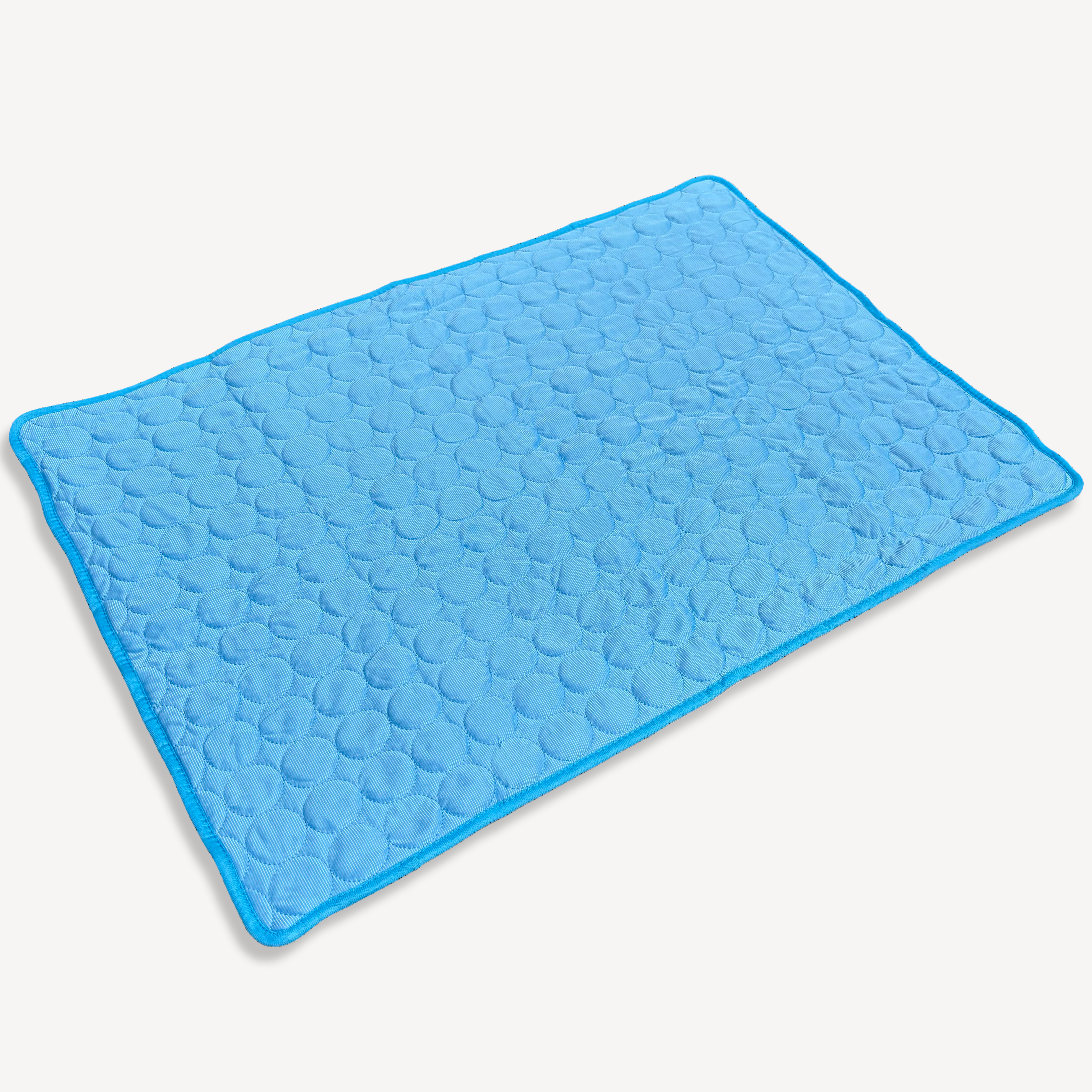 A blue cooling pad designed for pets, featuring a textured surface.